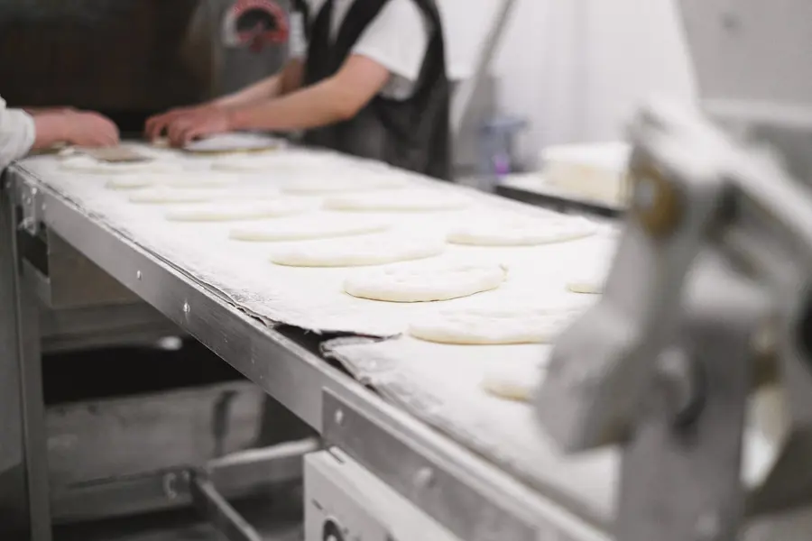 Dough moving down a bakery production line